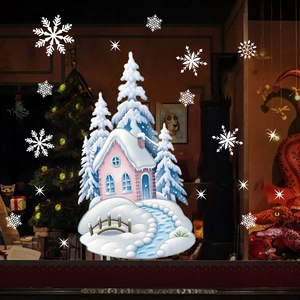 Christmas window decals with winter cottage scene and snowflakes for holiday store decoration