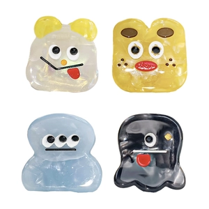 Set of four cute cartoon acetate hair claws with funny facial expressions and pearly finish