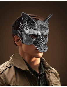 Detailed view of silver wolf mask showing intricate fur texture and metallic finish