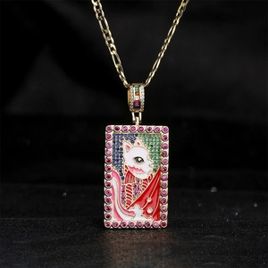 Golden Figaro chain necklace with a white cat enamel pendant and colorful crystals