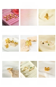 Macro shot of 18K gold plated stainless steel rings and earrings in elegant display