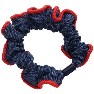 Polka dot fabric scrunchie with red crochet edges and navy blue connector