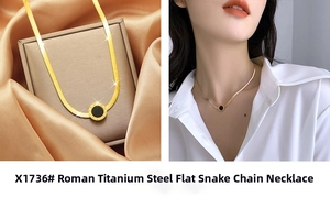 Macro detail of gold roman numeral flat snake chain necklace with black pendant
