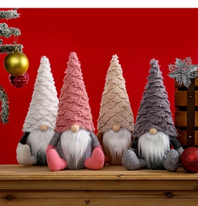 Detailed close-up of four plush Christmas gnomes with textured hats and long white beards