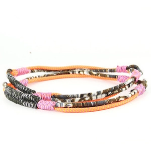 Detail of colorful handmade braided hemp ropes with ethnic style bull head ornaments