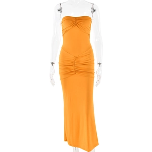 Detail of orange tube maxi dress featuring slim-fit ruched waist and strapless design