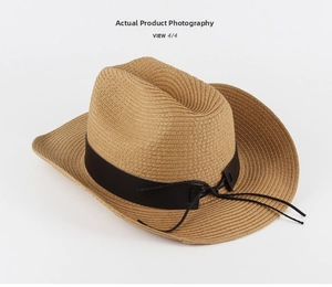 Close-up of khaki straw cowboy hat with a brown faux leather band and woven texture