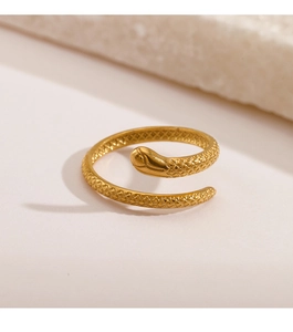 Macro shot of gold snake ring featuring detailed scales and smooth adjustable metal band