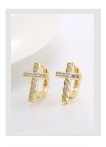 Detailed macro view of S925 sterling silver stamp and zircon cross earrings