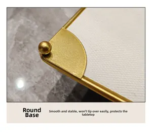 Macro view of gold metal frame with protective bead feet on white textured bathroom tray