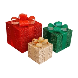 Three-piece decorative Christmas gift box set in red, green and gold with ribbon bows