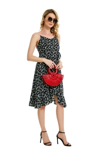 Red bamboo-woven fan-shaped handbag paired with a stylish black floral midi dress