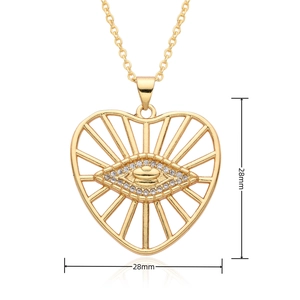 Detailed view of 28mm golden heart pendant with crystal eye and mirror reflections