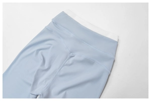 Detailed view of high-waisted yoga leggings featuring a dual-layer ribbed waistband