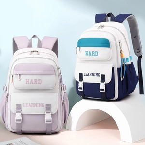 Minimalist college-style backpack with multi-pocket design and 'Hard Learning' print