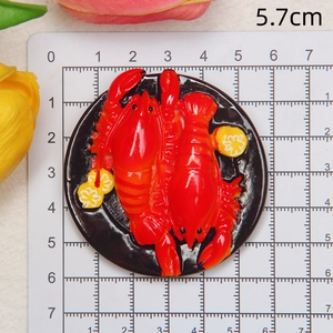 Detailed macro view showing a 5.7cm resin lobster food magnet on a measuring ruler