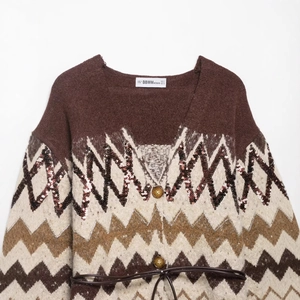 Women's knit cardigan featuring geometric wave patterns and sequins with waist belt