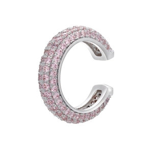 Macro shot of silver C-shaped ear cuff with pink cubic zirconia and polished plating