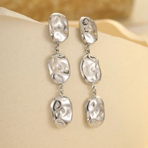 Three-tier silver irregular oval drop earrings with hammered metal texture design