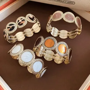 Vintage leopard print and enamel stretch bracelets in gold round link design