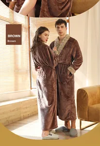 Detail of plush beige faux fur trim on sleeves of thick brown flannel bathrobe