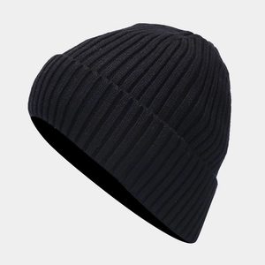 Detailed view of black ribbed knit beanie featuring thick thermal texture and elastic cuff