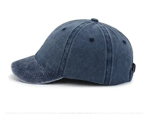 Side view of retro washed navy cotton baseball cap showing short brim and metal buckle
