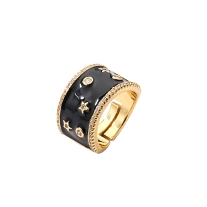 Anello stella moderno in rame placcato oro con smalto nero e accenti di zircone