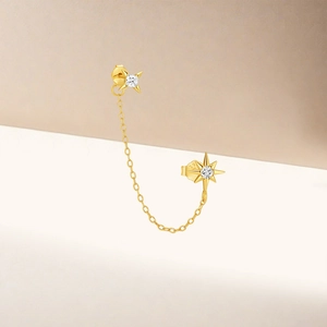 Close-up of S925 sterling silver gold-plated star chain earrings with zircon detail
