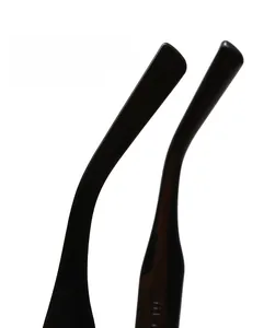 Detail of the non-slip arc design on black sunglass temples with glossy finish