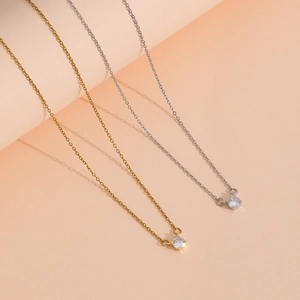 Elegant gold and silver titanium steel necklaces with a sparkling single diamond pendant