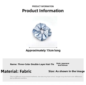Detail showing light blue satin hair scrunchie with 15cm size measurement display