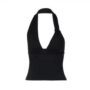 Detail of black halter neck top featuring a deep V-neck and stretchy fabric texture