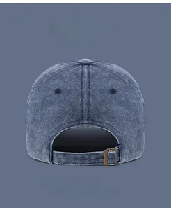Close-up of the back of the washed cotton cap with adjustable metal buckle and air vents