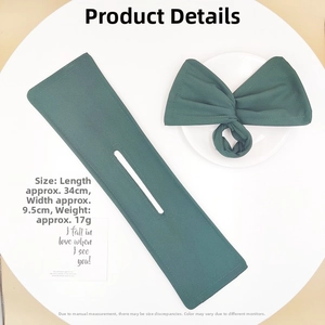 Detail view showing dimensions of dark green fabric deft bun hair maker 34cm x 9.5cm