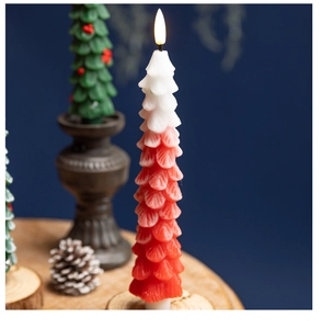 Detail of red and white gradient Christmas tree LED candle with wax texture surface