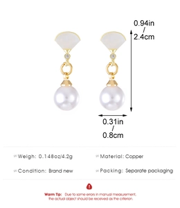Detail view of pearl drop earrings with copper fan shape, 2.4cm height and 0.8cm width
