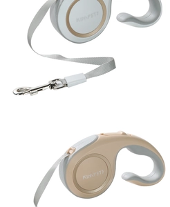 Detail view of ergonomic C-shaped handles on retractable dog leashes in white and beige