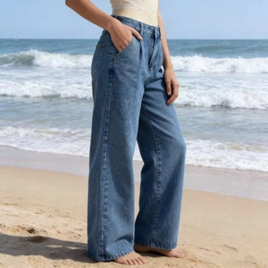 Detail of high-waisted wide-leg denim jeans showing stitching and side pocket texture