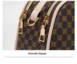 Detail of smooth double golden zippers on a dark brown floral patterned handbag