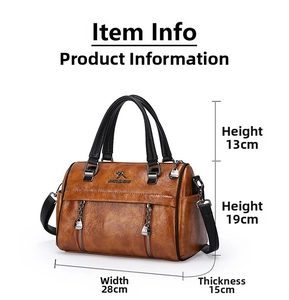 Detail view of a vintage brown leather tote bag showing exact size and dimensions