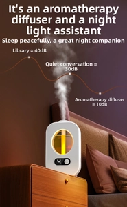 Close-up of smart aroma diffuser with warm night light and digital display on wooden table