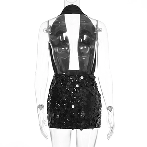 Detailed back view of a black sequin bodycon dress with halter neck and open back