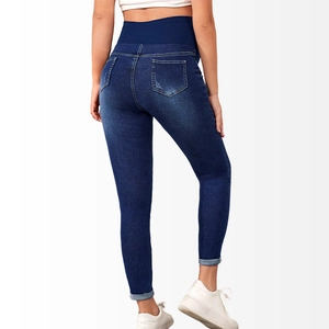 Detail view of maternity skinny jeans with high elastic belly band and push-up effect