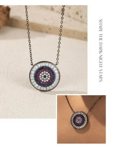 Macro detail of S925 silver necklace with turquoise evil eye pendant and zircon stones