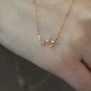 S925 sterling silver 14K gold floral necklace with white cubic zirconia flower pendants