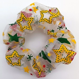 Christmas mesh scrunchie with colorful holiday patterns on white background