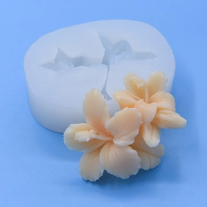 Hibiscus flower silicone mold for baking with two pink realistic floral finished pieces