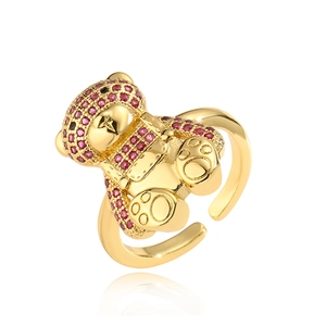 Adjustable 18K gold plated bear ring with red zircon stones on a white background