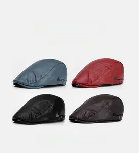 Detailed view of leather newsboy caps in four colors with textured finish and side buckles